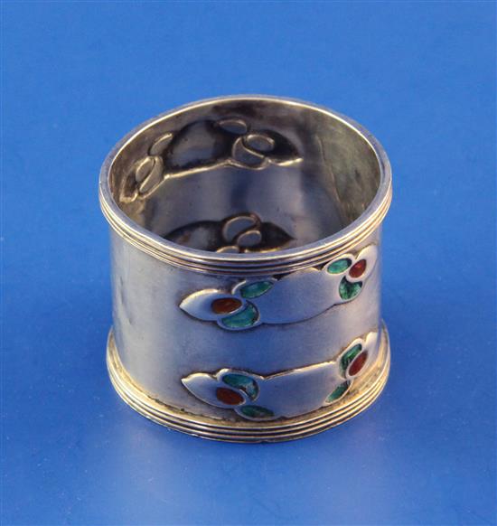 An Edwardian Art Nouveau Liberty & Co Cymric silver and enamel napkin ring, 1.5in.